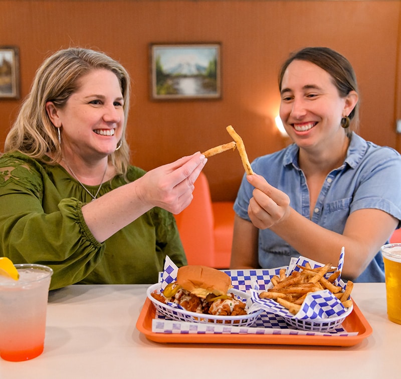 Bonafried customers enjoying fries at the bar